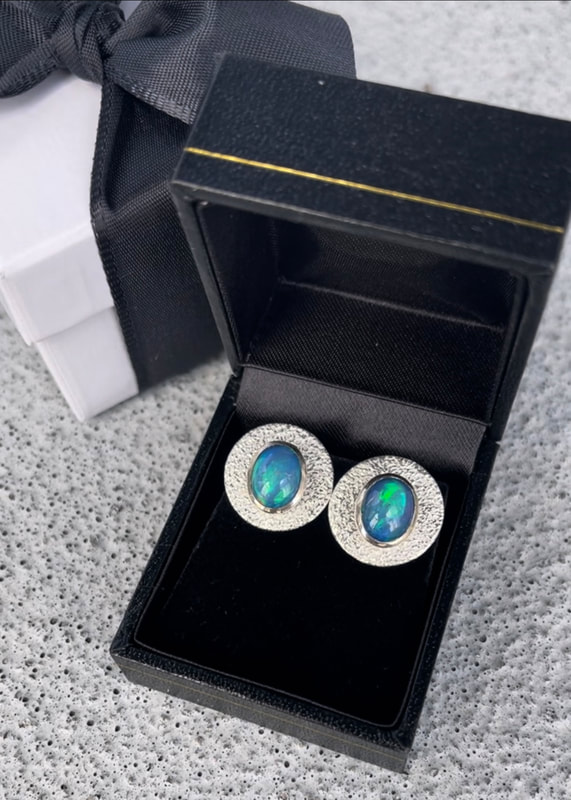 Ehiotpian Blue Opal Stud Earrings with Sterling Silver Earring Jackets in a leatherette presentation gift box